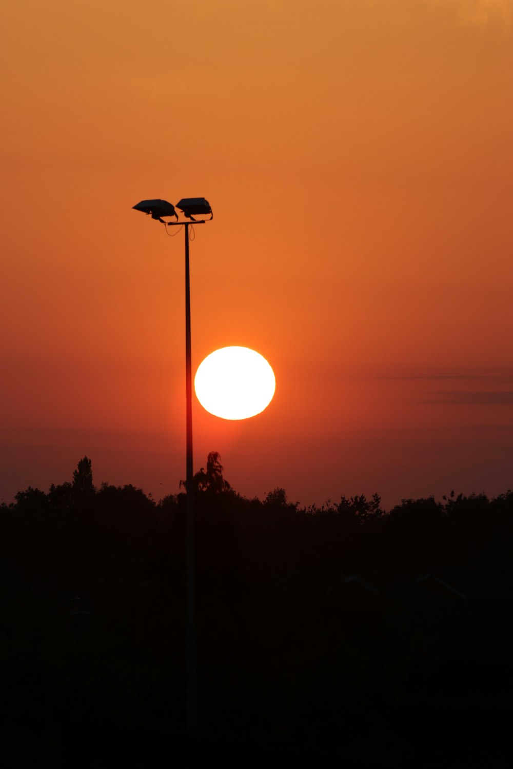 a sunset with street lights