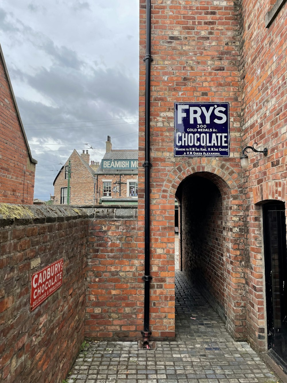 a brick building with a sign on it