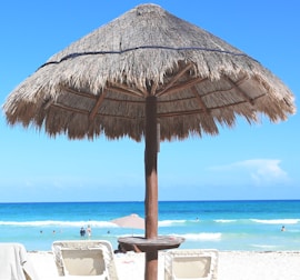 a straw umbrella on a beach