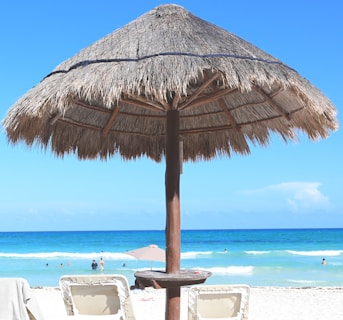 a straw umbrella on a beach
