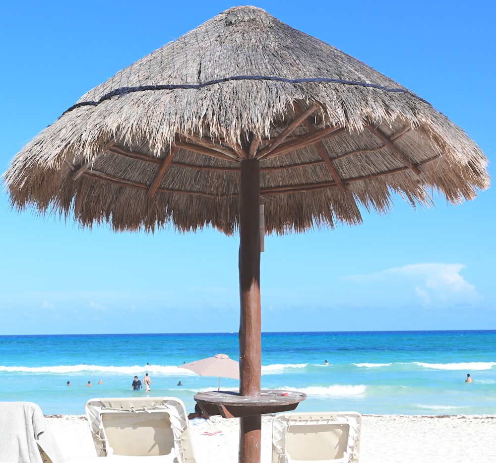 a straw umbrella on a beach