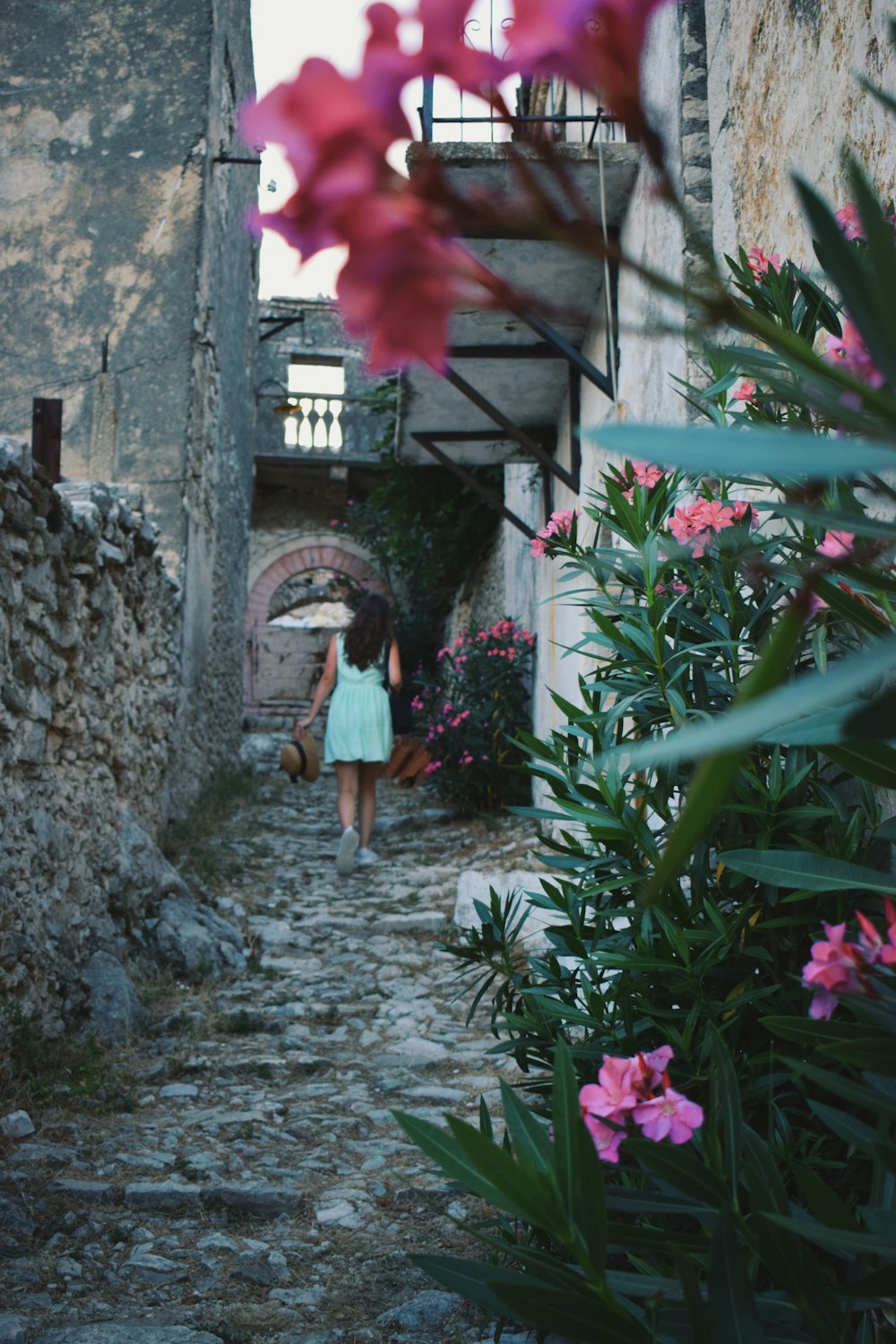 a person walking down a stone path