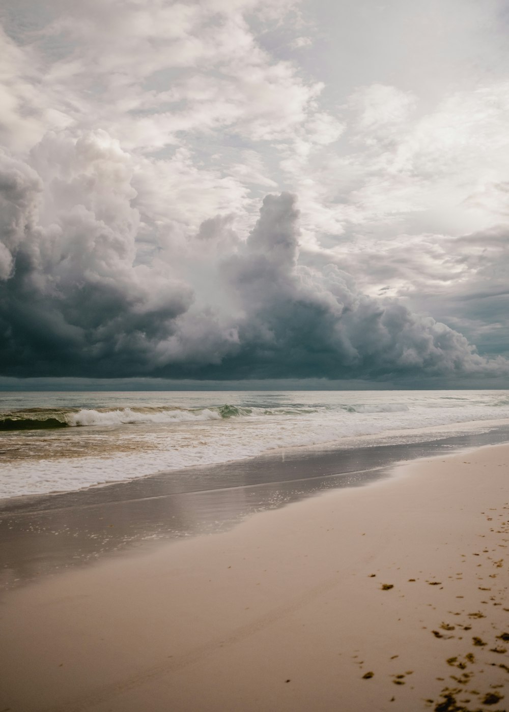 a beach with waves crashing on it