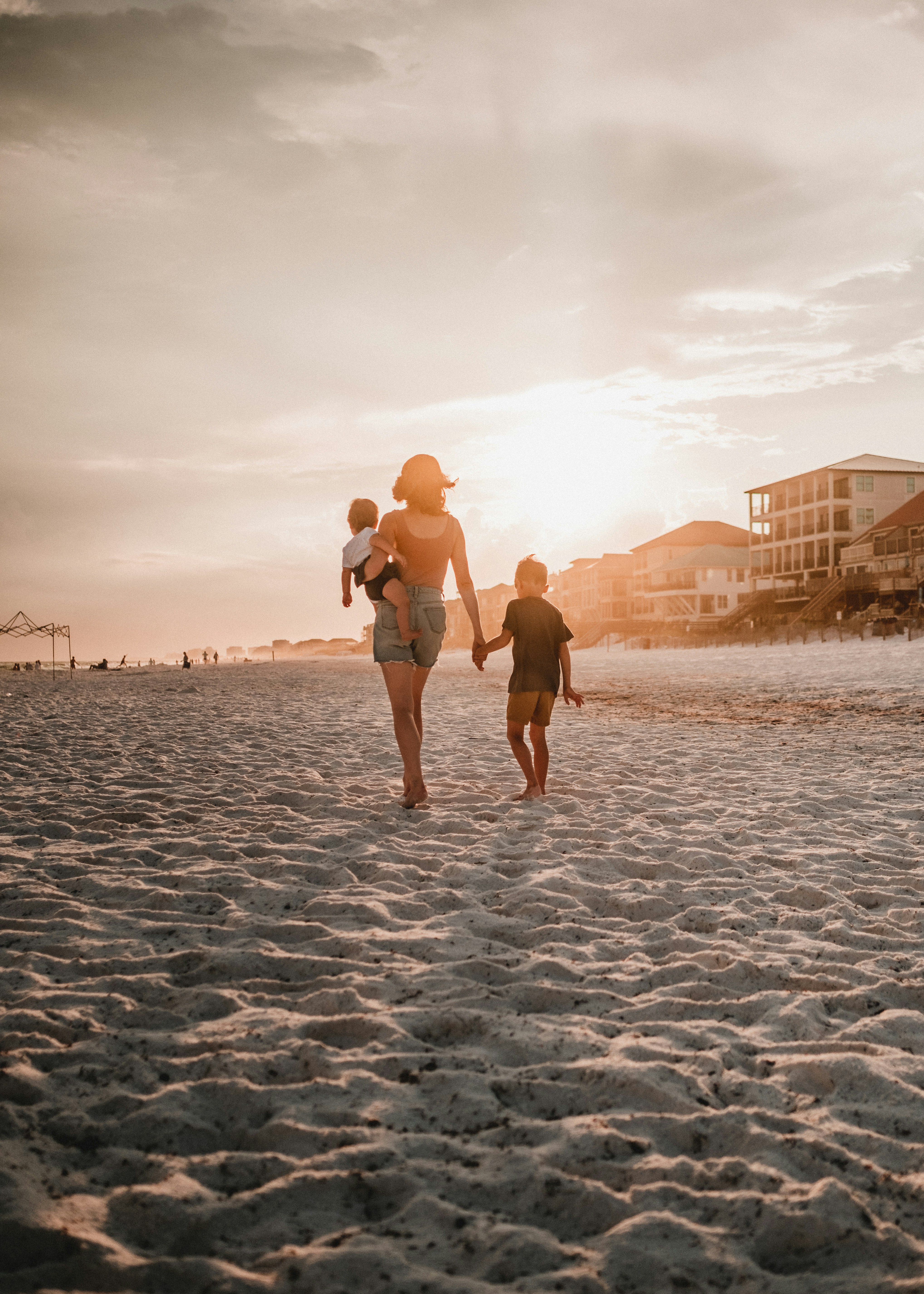 a man and a woman walking on a beach