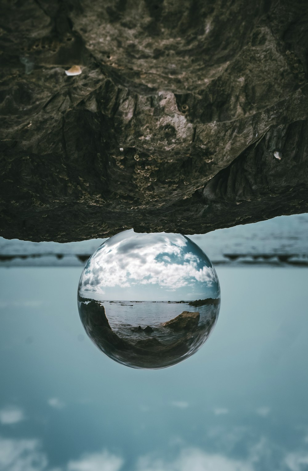 a glass of water on a rock