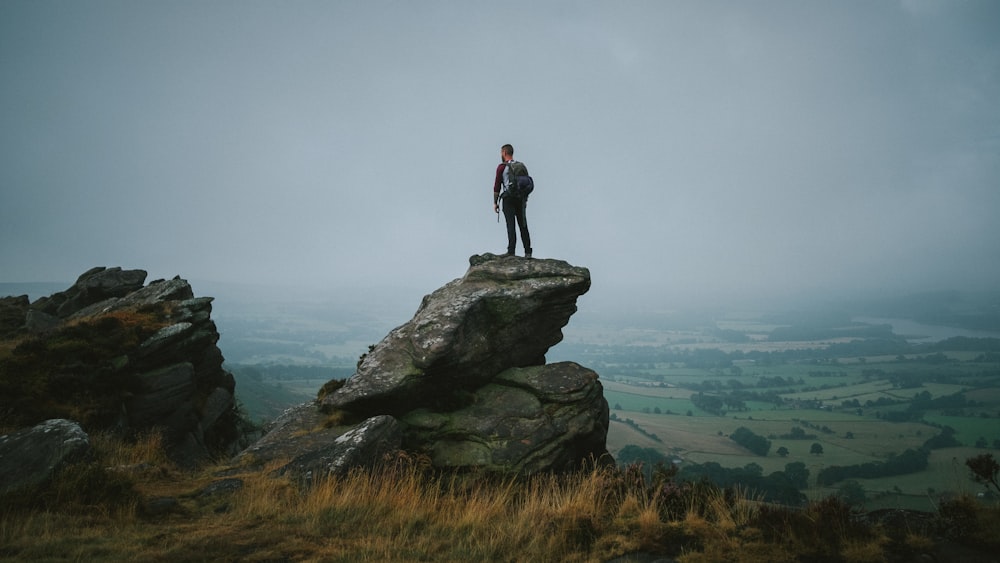 a man standing on a rock