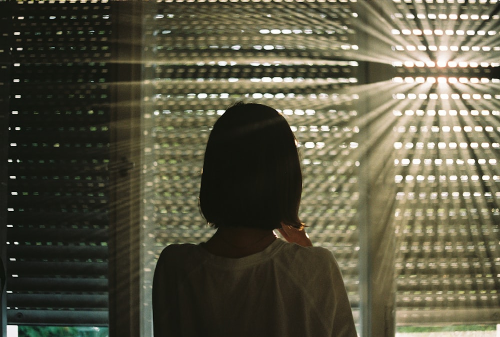 a person looking through a window