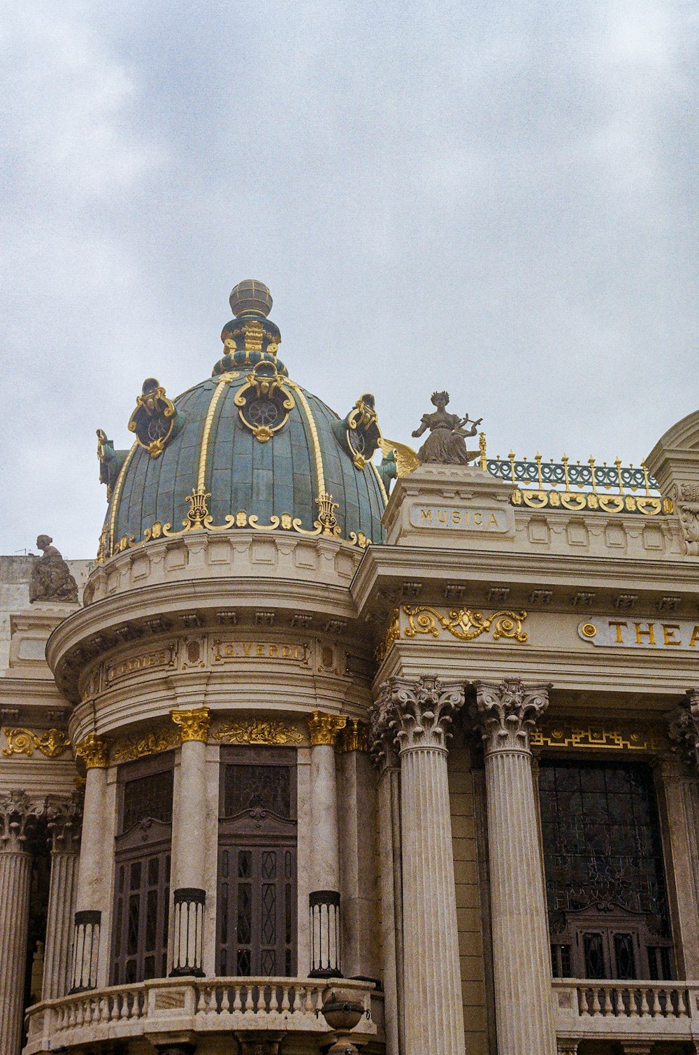 a building with a dome and statues
