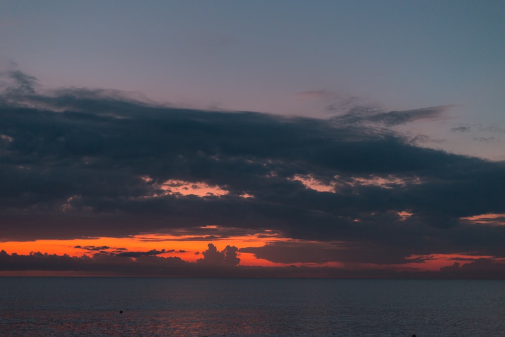 a sunset over a body of water