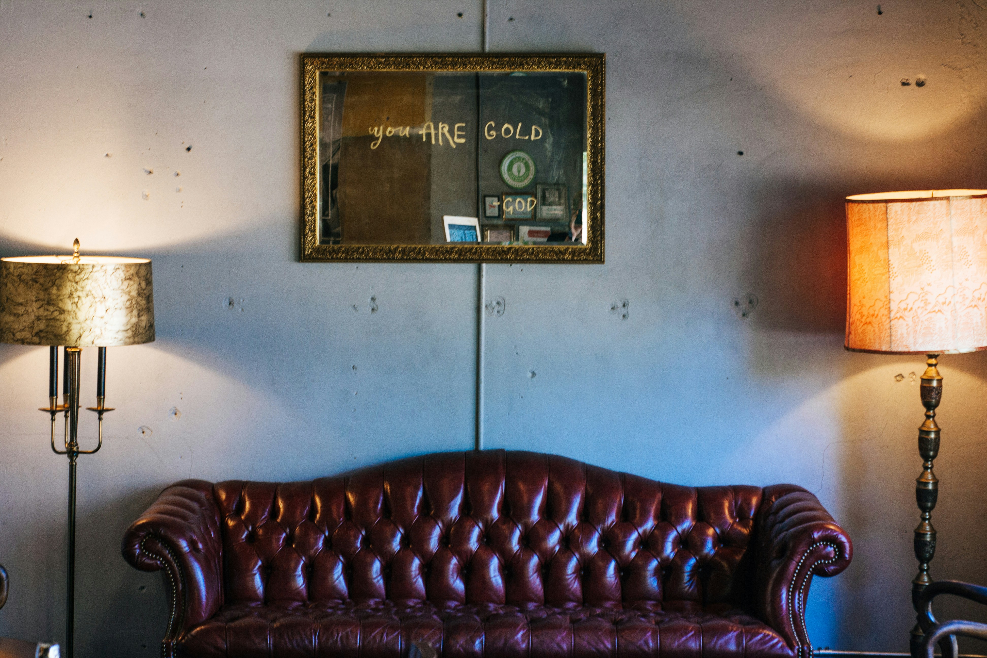 a couch in a room with lamps