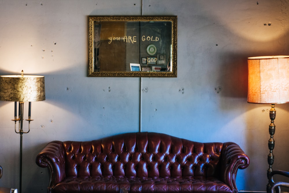 a couch in a room with lamps