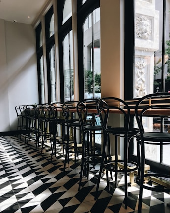 Stylish cafe interior redesign featuring warm beige and black accents