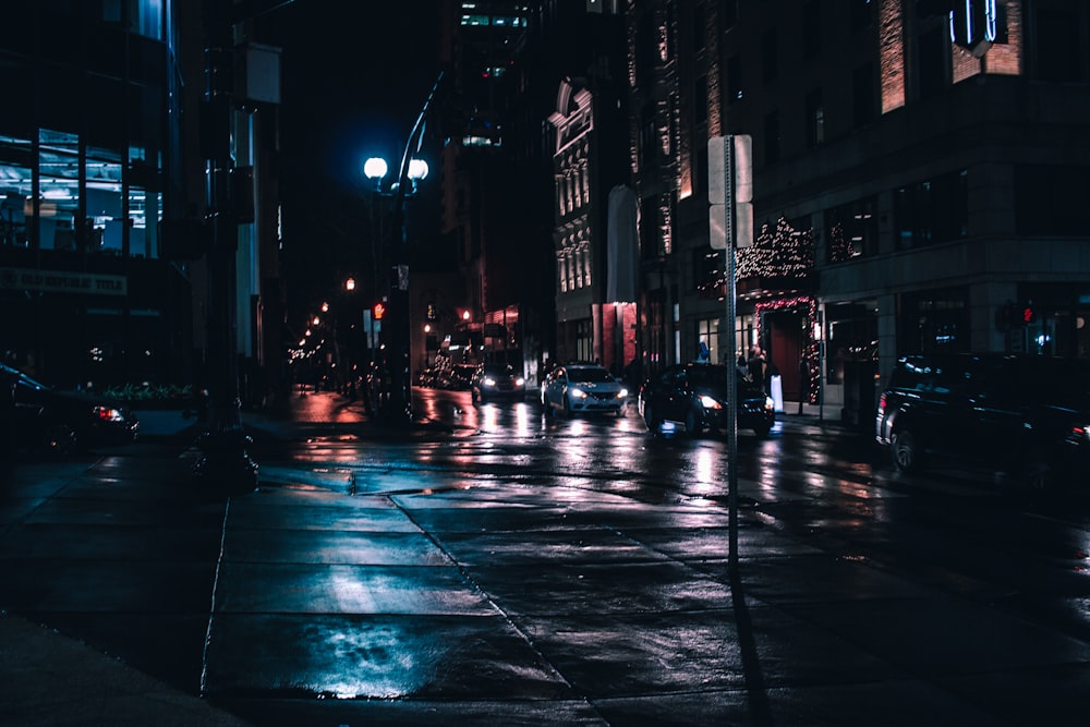 a wet city street at night