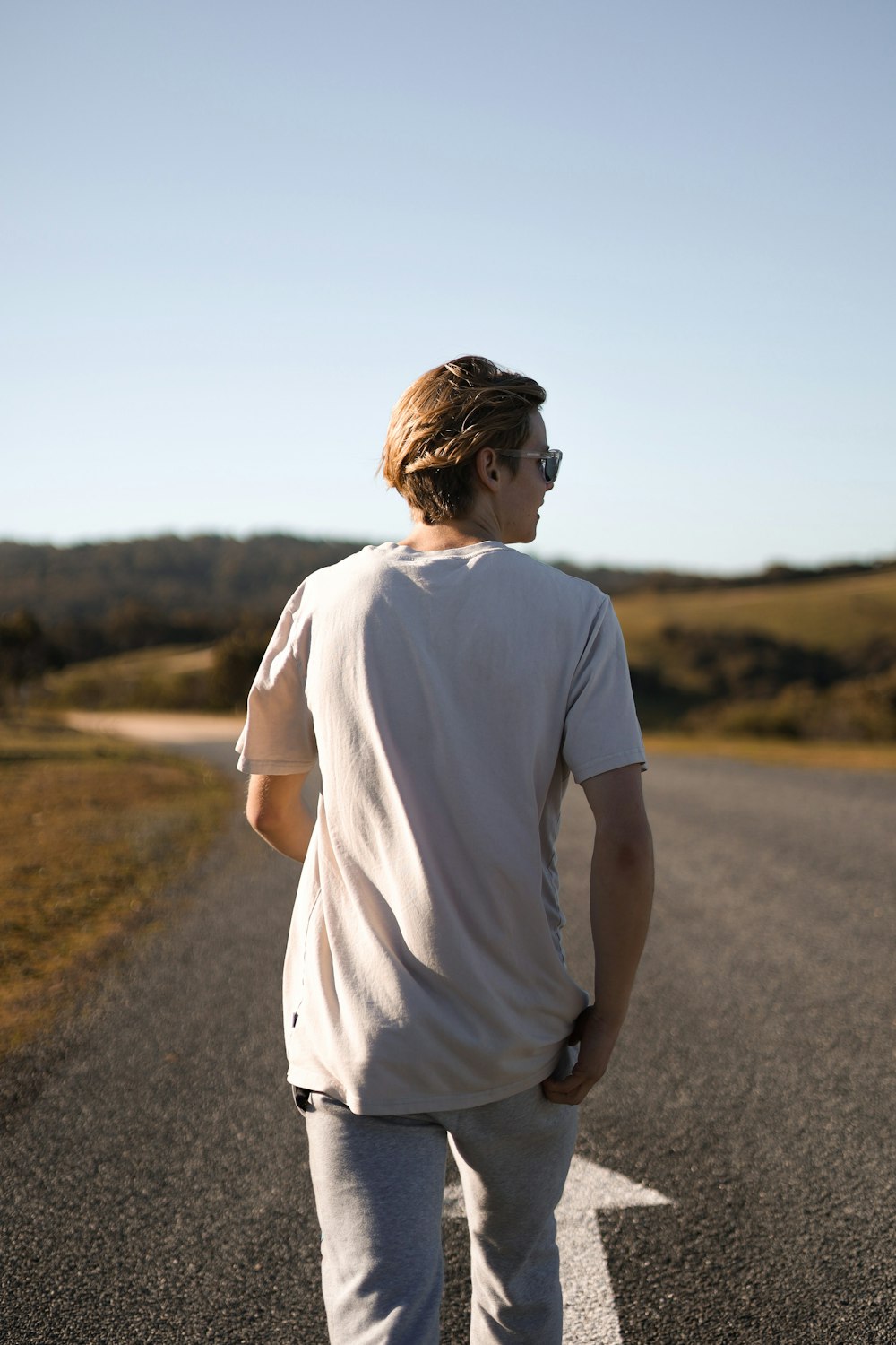 a man standing on a road