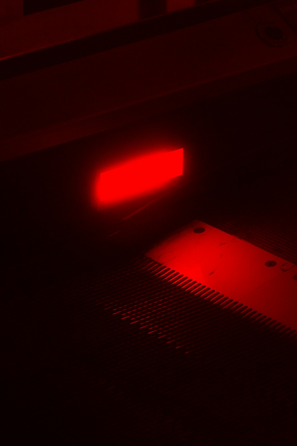 a red light on a black background