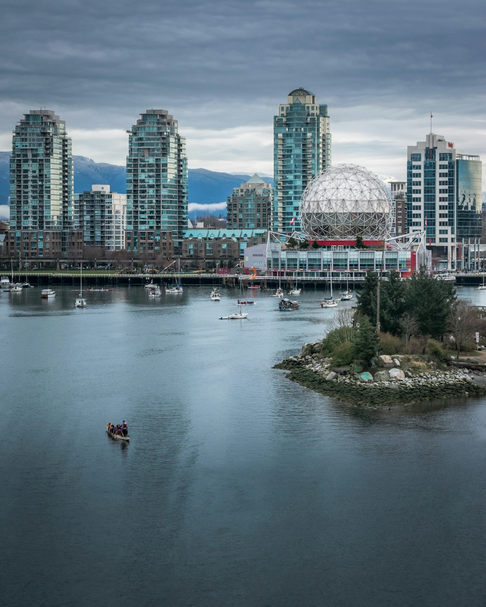 a city skyline with a river