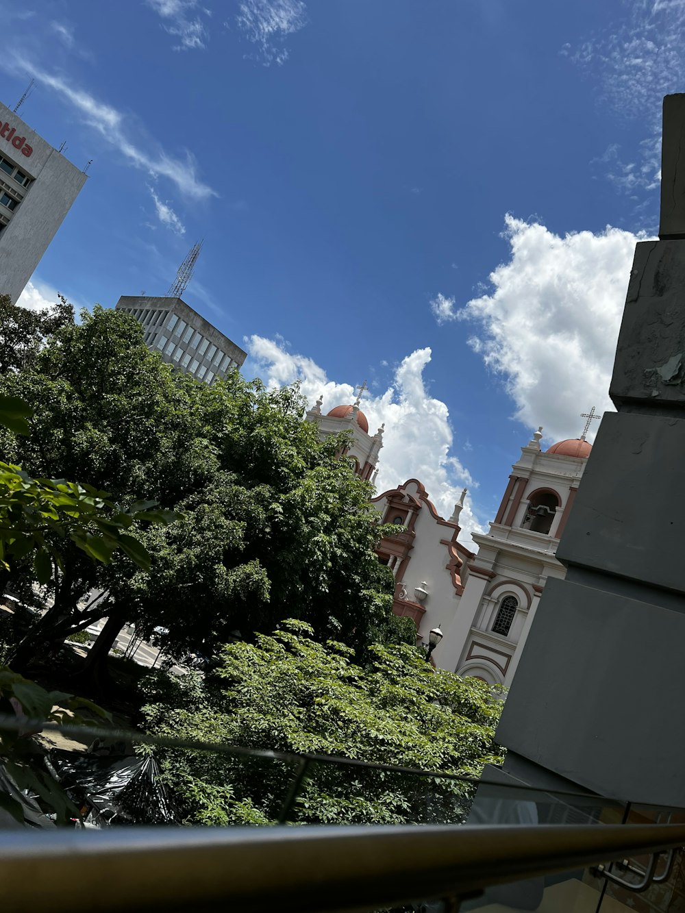 a building with a tower and trees