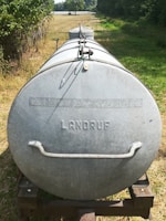 a large metal cylinder with a round top and a round top