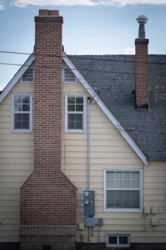a brick building with a chimney