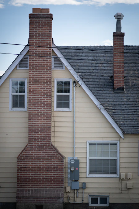 a brick building with a chimney