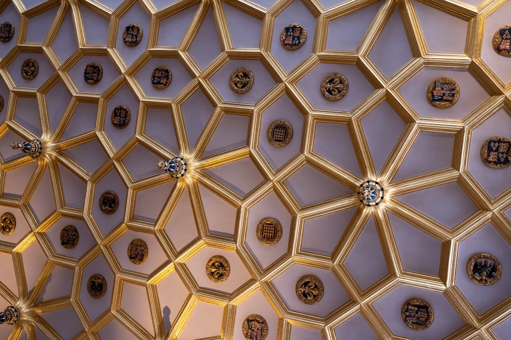 a ceiling with many clocks