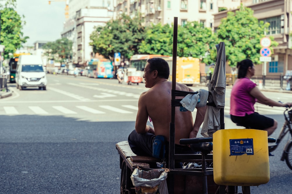 a man and woman riding a scooter