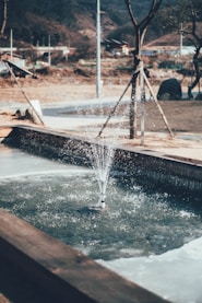 a water fountain in a park