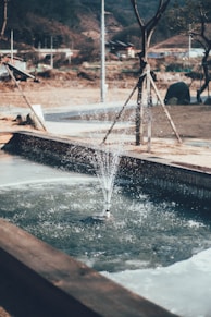 a water fountain in a park