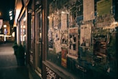 A vibrant street view of a small business with eye-catching advertisement posters.