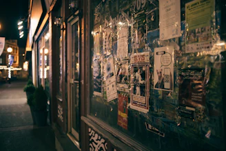 Colorful street posters and flyers promoting local businesses in Buenos Aires.