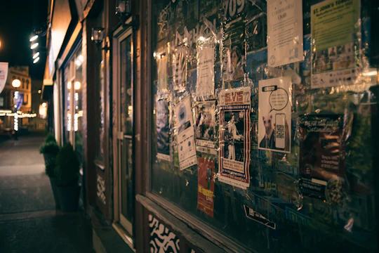 Colorful street posters and flyers promoting local businesses in Buenos Aires.