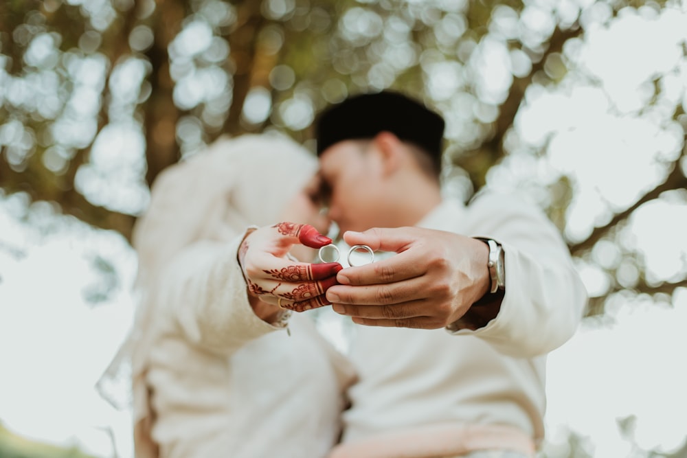 a person holding a red heart