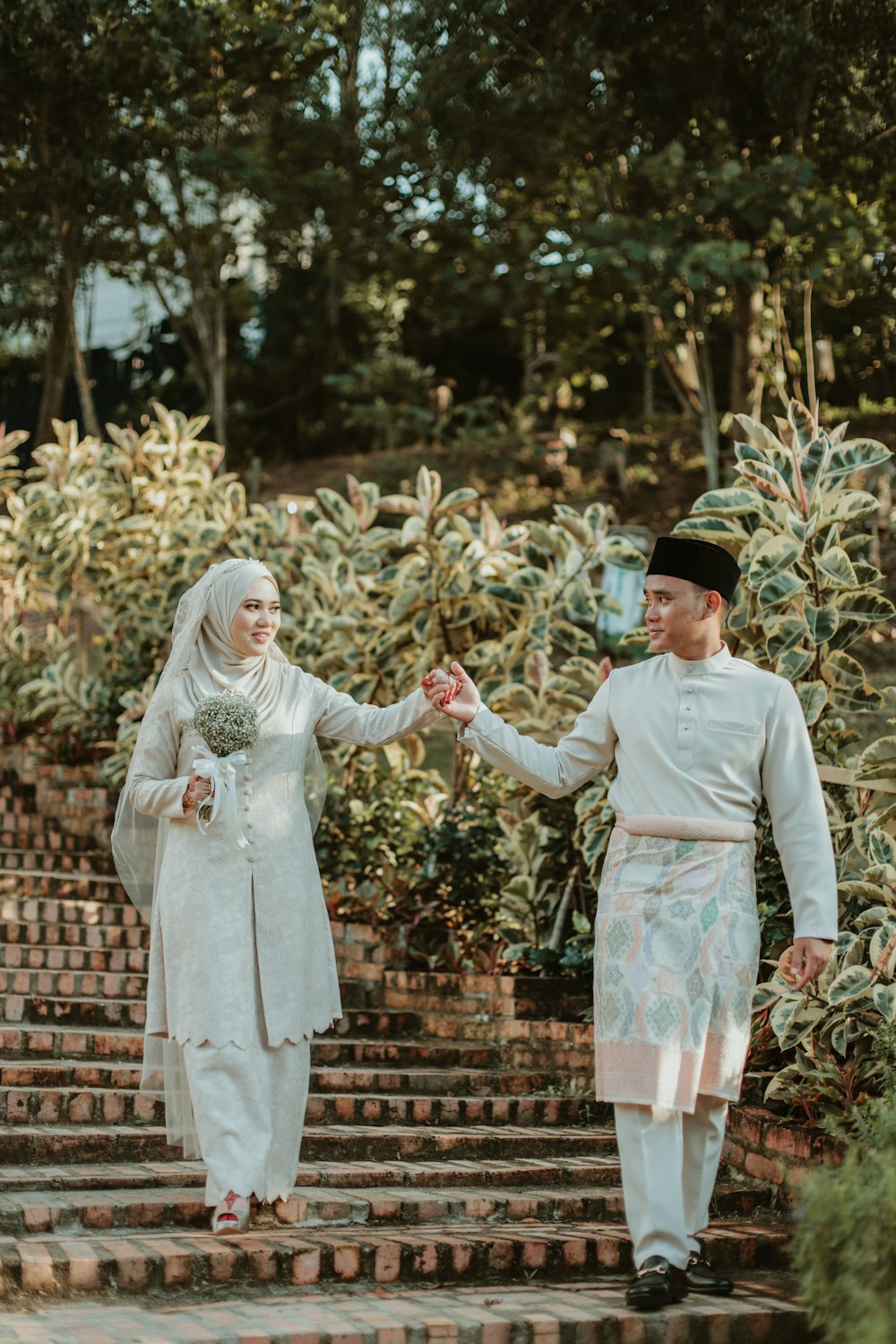 a man and woman in wedding attire