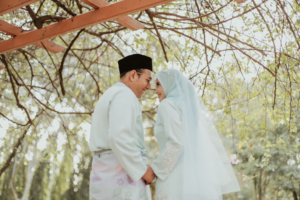 a man and woman in white robes