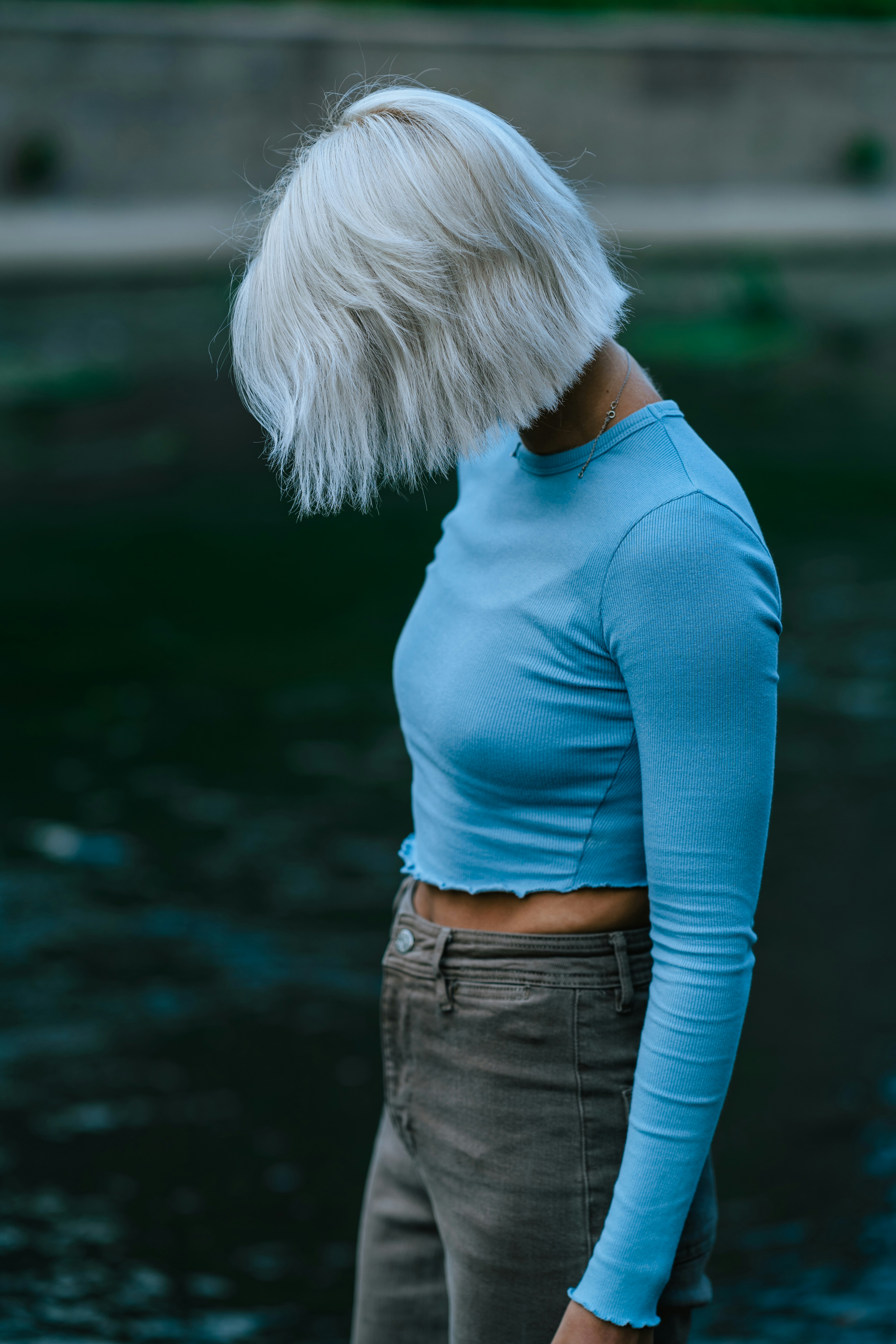 a person with the hair blowing in the wind