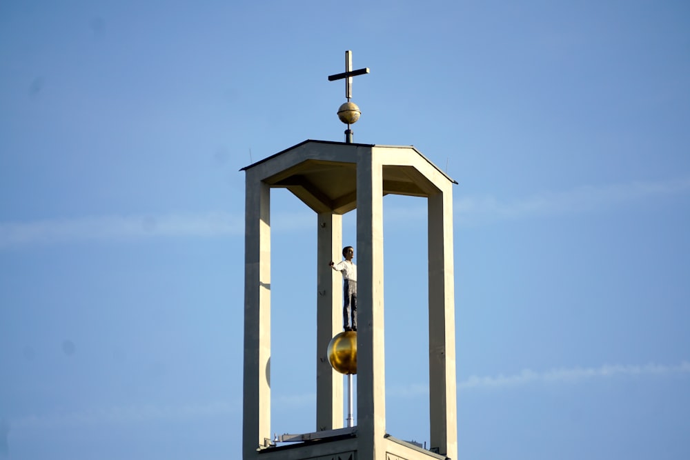 a person standing on a cross