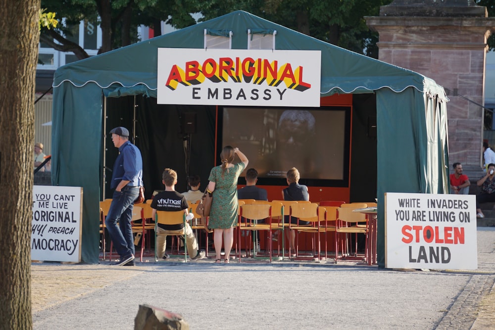 a group of people outside a restaurant