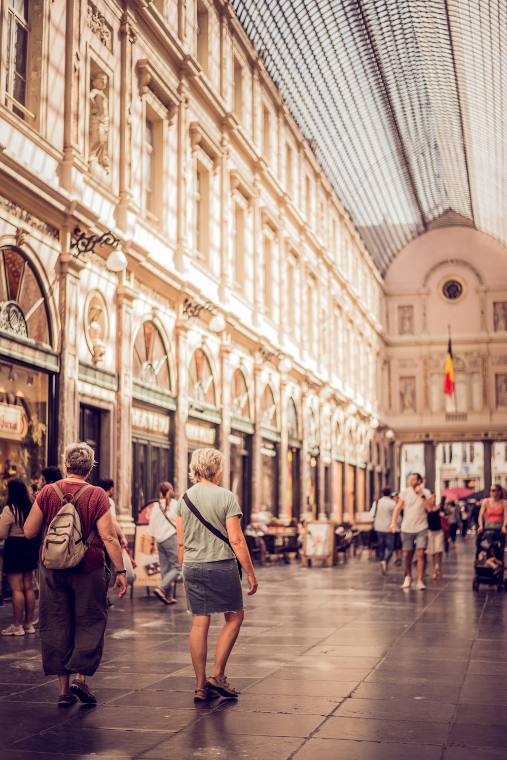 people walking in a large building