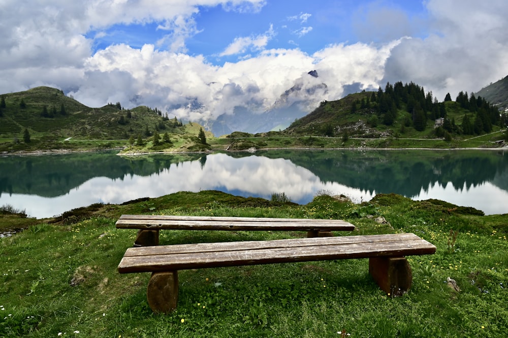 a bench sits in front of a lake