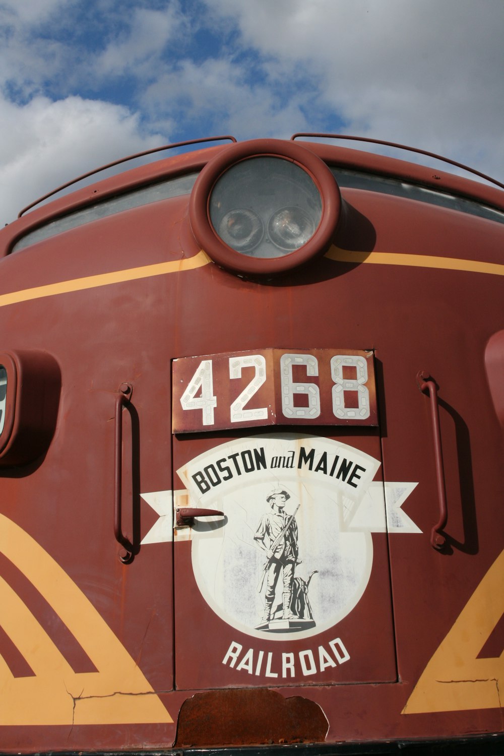 a red train with a sign on it