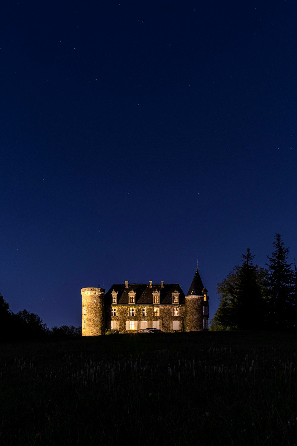 a building with a tower at night