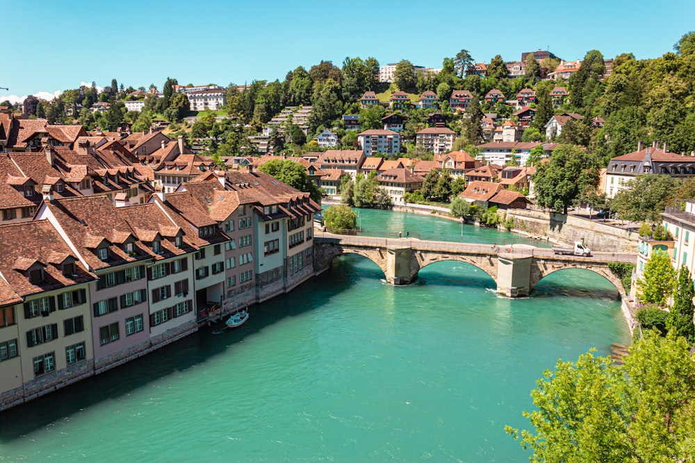 a bridge over a river with buildings on either side of it