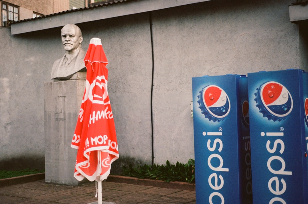 a statue of a person holding a flag