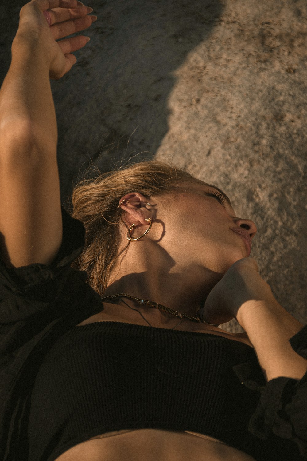 a person lying on the sand