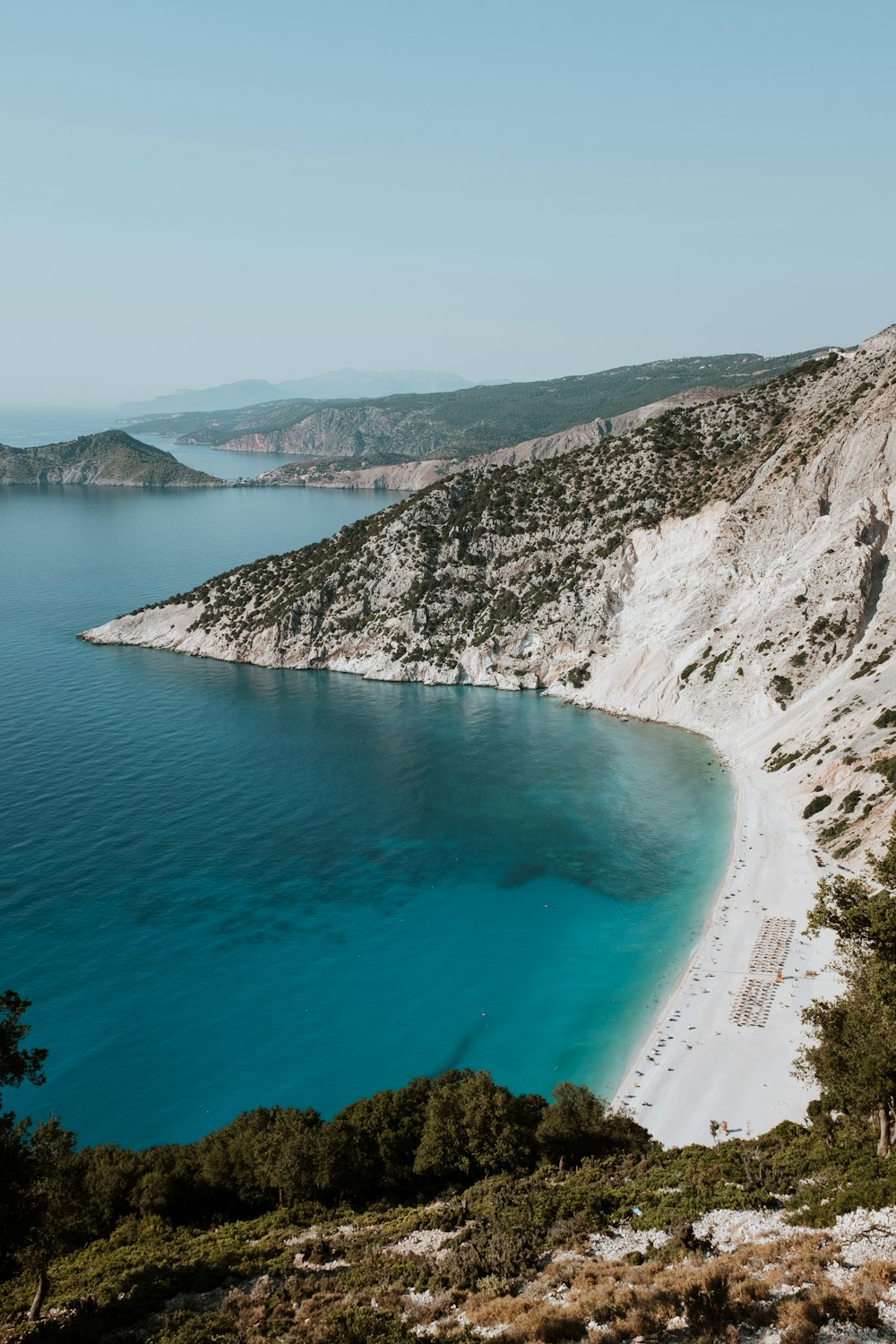 a body of water with a rocky shoreline