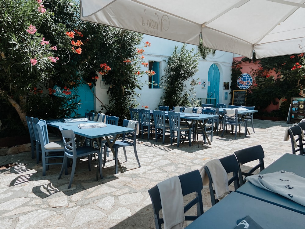 a group of tables and chairs outside