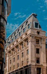A beautifully restored historic stone building with modern glass additions.