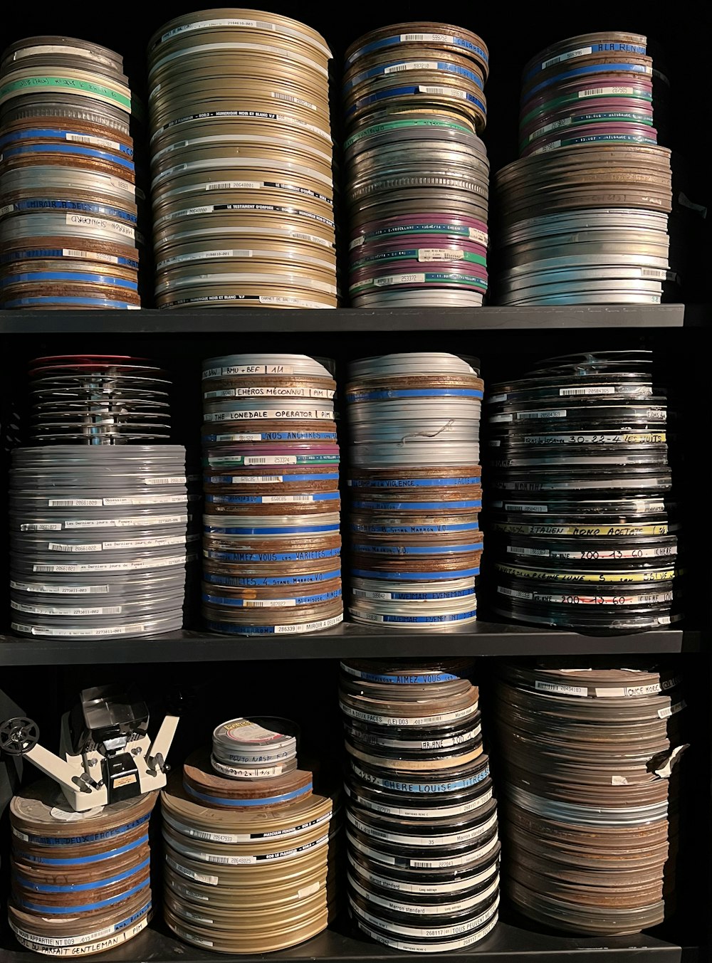 a shelf with many cans of paint