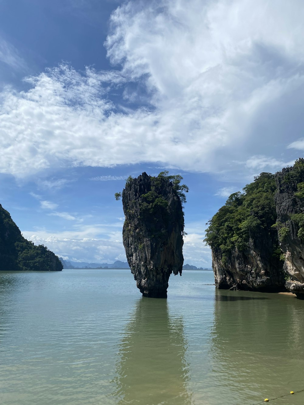 a large rock in the water