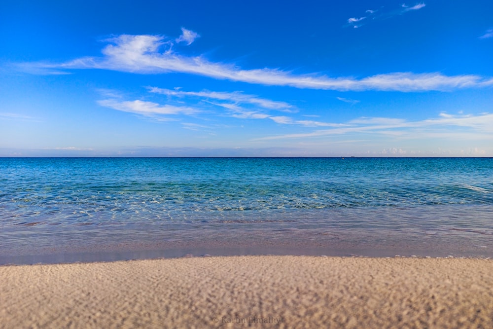 a beach with blue water